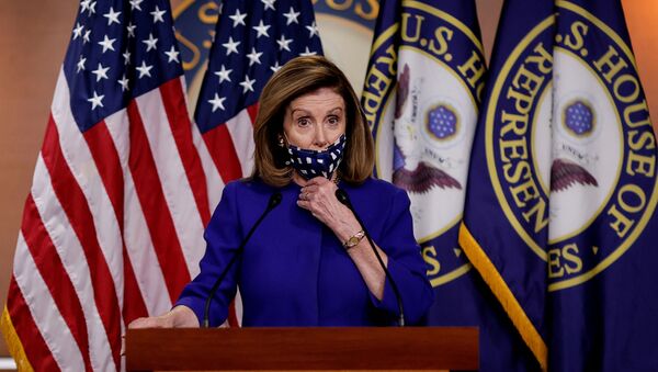 US House Speaker Nancy Pelosi adjusts her face mask as she announces her plans for Congress to create a Commission on Presidential Capacity to Discharge the Powers and Duties of Office Act after US President Donald Trump came down with coronavirus disease (COVID-19), during a Capitol Hill news conference in Washington, US, 9 October 2020. - Sputnik International