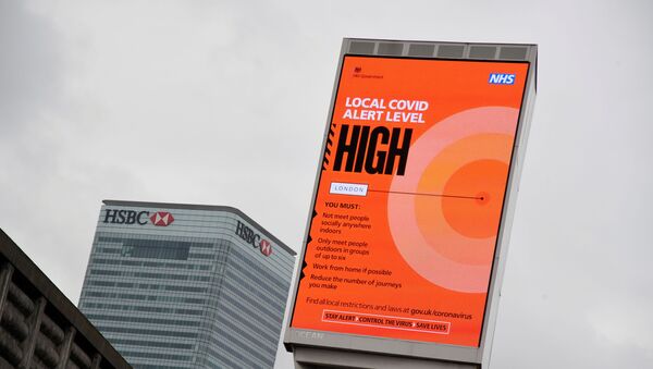 A government local COVID-19 alert level sign is pictured amid the outbreak of the coronavirus disease (COVID-19) in London, Britain, October 17, 2020.  - Sputnik International