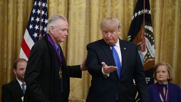 President Donald Trump gestures after presenting a National Medal of the Arts to actor Jon Voight, during a National Medal of Arts and National Humanities Medal ceremony in the East Room of the White House, 21 November 2019 - Sputnik International