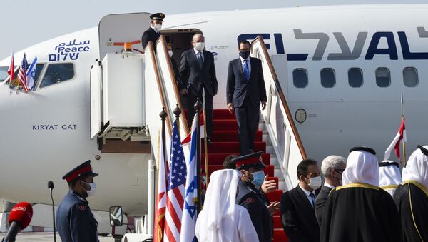 Head of Israel's National Security Council Meir Ben-Shabbat (L) and US Treasury Secretary Steve Mnuchin disembark from a plane upon their arrival at the Bahraini International Airport on October 18, 2020.  - Sputnik International