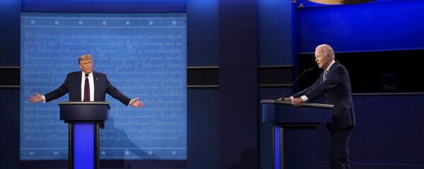 President Donald Trump, left, reacts as former Vice President Joe Biden speaks during the first presidential debate Tuesday, Sept. 29, 2020, at Case Western University and Cleveland Clinic, in Cleveland, Ohio President Donald Trump, left, reacts as former Vice President Joe Biden speaks during the first presidential debate Tuesday, Sept. 29, 2020, at Case Western University and Cleveland Clinic, in Cleveland, Ohio - Sputnik International
