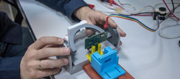 Ear clip glucometer prototype. Ear clip glucometer prototype. - Sputnik International