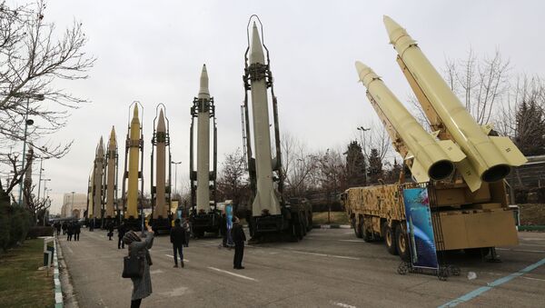 A file photo taken on February 2, 2019 shows Iranians visiting a weaponry and military equipment exhibition in the capital Tehran, organised on the occasion of the 40th anniversary of the Iranian revolution. - A longstanding UN embargo on arms sales to and from Iran expired early on October 18, 2020, in line with a 2015 landmark nuclear deal, the Iranian foreign ministry said. - Sputnik International