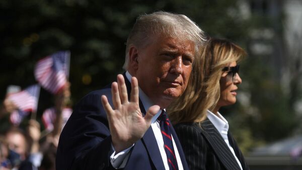 U.S. President Donald Trump waves to reporters as he departs with first lady Melania Trump for campaign travel to participate in his first presidential debate with Democratic presidential nominee Joe Biden in Cleveland, Ohio from the South Lawn at the White House in Washington, U.S., September 29, 2020. President Trump recently announced that he and the first lady have both tested positive for the coronavirus disease (COVID-19). Picture taken September 29, 2020.  - Sputnik International