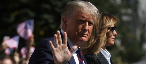 U.S. President Donald Trump waves to reporters as he departs with first lady Melania Trump for campaign travel to participate in his first presidential debate with Democratic presidential nominee Joe Biden in Cleveland, Ohio from the South Lawn at the White House in Washington, U.S., September 29, 2020. President Trump recently announced that he and the first lady have both tested positive for the coronavirus disease (COVID-19). Picture taken September 29, 2020.  - Sputnik International