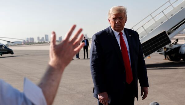 U.S. President Donald Trump answers a question from Reuters' journalist Jeff Mason before departing for a campaign rally in Tucson, at Phoenix Sky Harbor International Airport in Phoenix, Arizona - Sputnik International