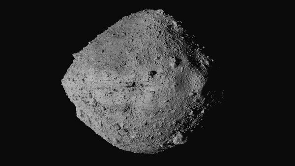 This undated image made available by NASA shows the asteroid Bennu from the OSIRIS-REx spacecraft. After almost two years circling the ancient asteroid, OSIRIS-REx will attempt to descend to the treacherous, boulder-packed surface and snatch a handful of rubble on Tuesday, Oct. 20, 2020. - Sputnik International