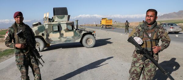 Afghan National Army (ANA) soldiers stand guard at a check point near the Bagram Airbase north of Kabul, Afghanistan April 2, 2020 Afghan National Army (ANA) soldiers stand guard at a check point near the Bagram Airbase north of Kabul, Afghanistan April 2, 2020 - Sputnik International