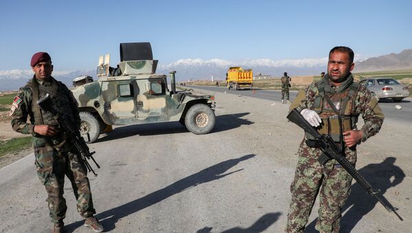  Afghan National Army (ANA) soldiers stand guard at a check point near the Bagram Airbase north of Kabul, Afghanistan April 2, 2020 - Sputnik International