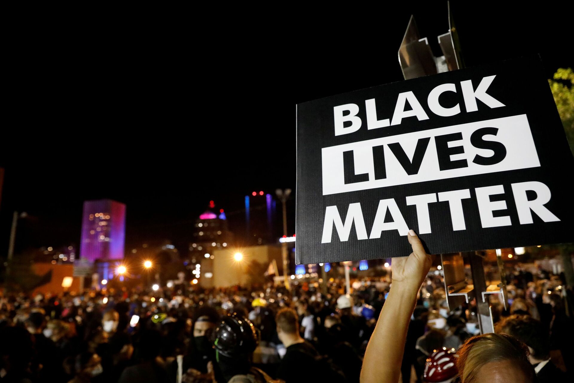 A demonstrator holds up a Black Lives Matter sign during a protest over the death of a Black man, Daniel Prude, after police put a spit hood over his head during an arrest on March 23, in Rochester, New York, U.S. September 6, 2020 - Sputnik International, 1920, 07.09.2021