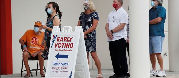 People line up at the Supervisor of Elections Office polling station as early voting begins in Pinellas County ahead of the election in Largo, Florida, US, 21 October 2020 - Sputnik International