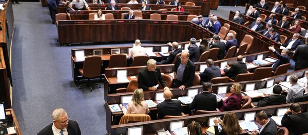 Israeli Kahol Lavan (Blue and White) political alliance leader Benny Gantz (L) walks during a session of the Knesset (Israeli parliament) in Jerusalem on December 11, 2019.  - Sputnik International