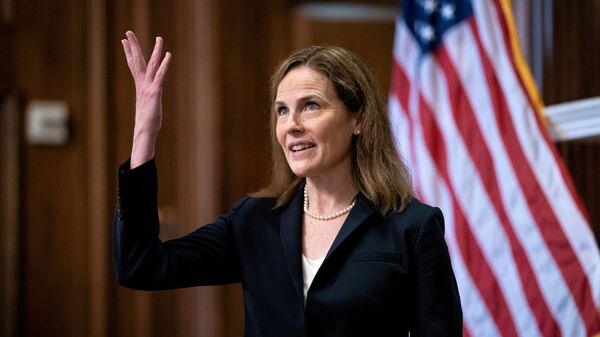 FILE PHOTO: Judge Amy Coney Barrett, U.S. President Donald Trump's Nominee for Supreme Court, gestures during a photo before a meeting with Senator Roy Blunt (R-Mo) on Capitol Hill in Washington DC, U.S. October 21, 2020 - Sputnik International