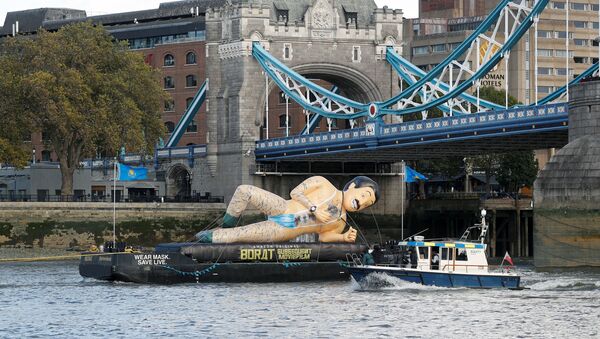 An inflatable Borat character promoting movie Borat Subsequent Moviefilm is carried along the River Thames from Tower Bridge aboard a barge, in London, Britain October 22, 2020.  - Sputnik International