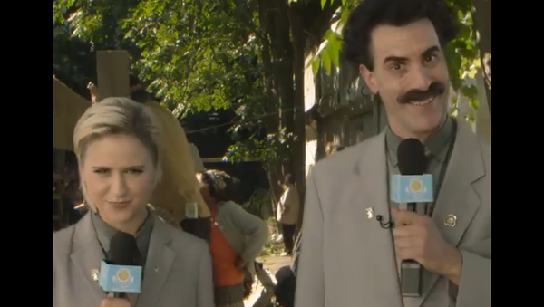 A screenshot from a video posted on the Twitter account of 'Borat Sagdiyev', the satirical fictional character played by British actor and comedian Sacha Baron Cohen, showing Borat and Bulgarian actress Mara Bakalova, who plays his daughter in the newly-released movie ‘Borat Subsequent Moviefilm’. - Sputnik International