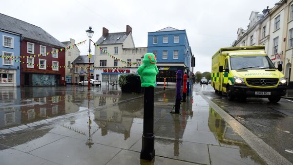 An empty street on the first full day of the Welsh fire-break lockdown, as the coronavirus disease (COVID-19) outbreak continues in Haverfordwest, Wales - Sputnik International