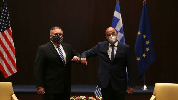 U.S. Secretary of State Mike Pompeo and Greek Foreign Minister Nikos Dendias touch elbows during their meeting in Thessaloniki, Greece, September 28, 2020. - Sputnik International