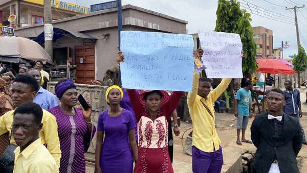 Worshippers take part in a protest calling for peace and unity after attending a Sunday service, as Nigeria's Lagos state eases a round-the-clock curfew imposed in response to protests against alleged police brutality, after days of unrest, in Lagos, Nigeria October 25, 2020 - Sputnik International