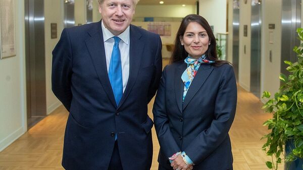 Prime Minister Boris Johnson with Home Secretary Priti Patel in the Home Office - Sputnik International