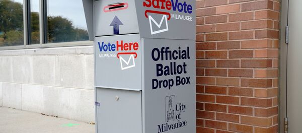 A SafeVote official ballot drop box for mail-in ballots is seen outside a polling site at the Milwaukee Public Library’s Washington Park location in Milwaukee, on the first day of in-person voting in Wisconsin, U.S., October 20, 2020. A SafeVote official ballot drop box for mail-in ballots is seen outside a polling site at the Milwaukee Public Library’s Washington Park location in Milwaukee, on the first day of in-person voting in Wisconsin, U.S., October 20, 2020. - Sputnik International