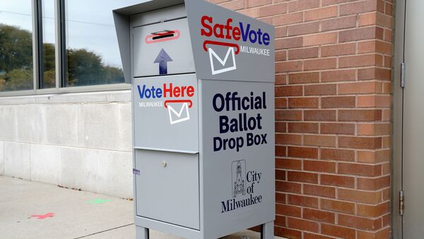 A SafeVote official ballot drop box for mail-in ballots is seen outside a polling site at the Milwaukee Public Library’s Washington Park location in Milwaukee, on the first day of in-person voting in Wisconsin, U.S., October 20, 2020. - Sputnik International
