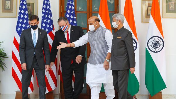 India's Defence Minister Rajnath Singh gestures to show the way to US Secretary of State Mike Pompeo and US Defense Secretary Mark Esper after they posed for a picture with India's Foreign Minister Subrahmanyam Jaishankar during a photo opportunity ahead of their meeting at Hyderabad House in New Delhi, India, October 27, 2020 - Sputnik International