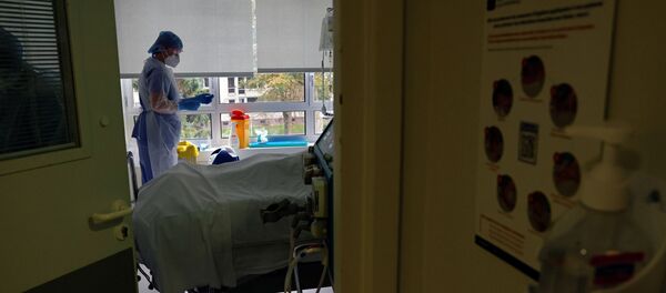 Nurses wearing protective masks and protective suits, work in the Intensive Care Unit (ICU) where patients suffering from the coronavirus disease (COVID-19) are treated at the Le Bois private hospital in Lille, France, October 28, 2020 - Sputnik International