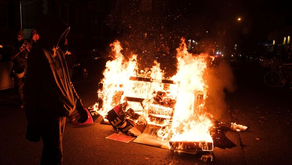 Fire burns as demonstrators clash with riot police during a rally after the death of Walter Wallace Jr., a Black man who was shot by police in Philadelphia, Pennsylvania, U.S., October 27, 2020 - Sputnik International