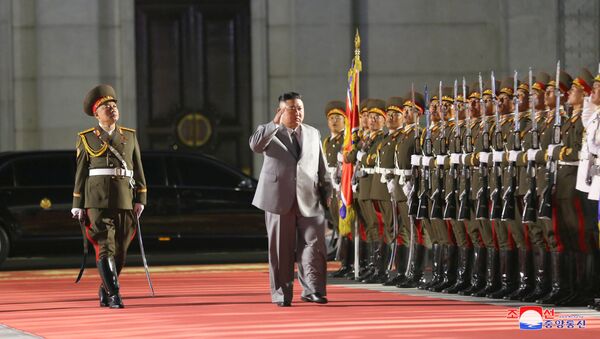 North Korean leader Kim Jong Un salutes as he attends a parade to mark the 75th anniversary of the founding of the ruling Workers' Party of Korea, in this image released by North Korea's Central News Agency on October 10, 2020 - Sputnik International