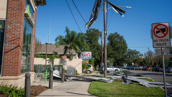 Part of a roof from Liberty Lumber Yard hangs from a power line after Hurricane Zeta swept through New Orleans, Louisiana, U.S., October 29, 2020. - Sputnik International