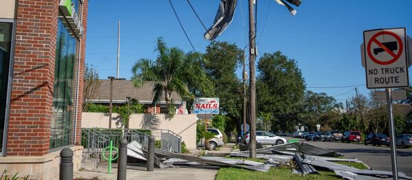 Part of a roof from Liberty Lumber Yard hangs from a power line after Hurricane Zeta swept through New Orleans, Louisiana, U.S., October 29, 2020. - Sputnik International