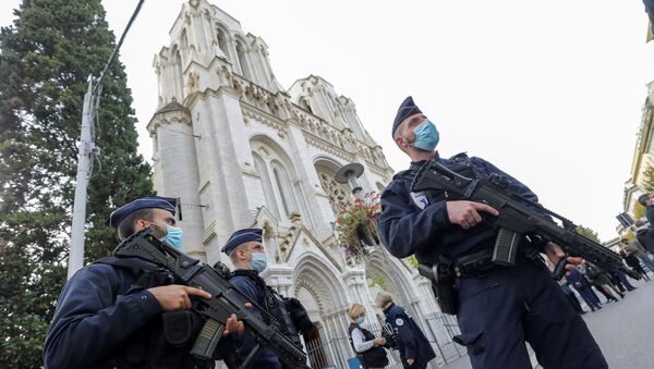 Police officers stand near Notre Dame church, where a knife attack took place, in Nice, France October 29, 2020. - Sputnik International