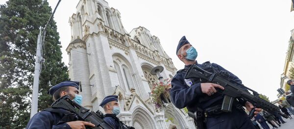 Police officers stand near Notre Dame church, where a knife attack took place, in Nice, France October 29, 2020. Police officers stand near Notre Dame church, where a knife attack took place, in Nice, France October 29, 2020. - Sputnik International