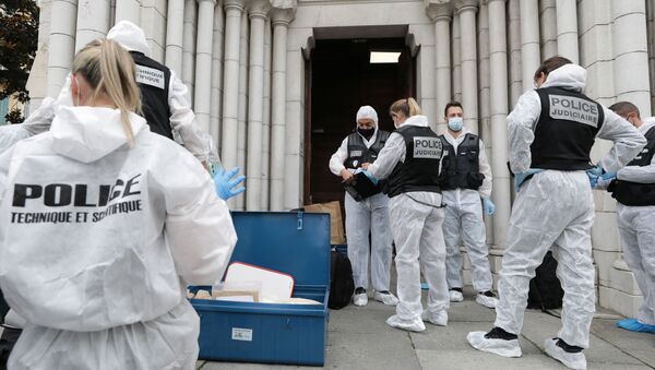 Forensic specialists inspect the scene of a reported knife attack at Notre Dame church in Nice, France, October 29, 2020 - Sputnik International