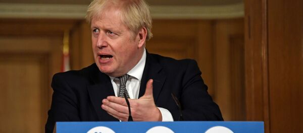 Britain's Prime Minister Boris Johnson speaks during a press conference at 10 Downing Street in London - Sputnik International