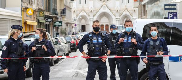 Police block the access to the Notre-Dame de l'Assomption Basilica in Nice on 29 October 2020, after a knife-wielding man kills three people at the church, slitting the throat of at least one of them, in what officials are treating as the latest jihadist attack to rock the country. (Photo by Valery HACHE / AFP) - Sputnik International