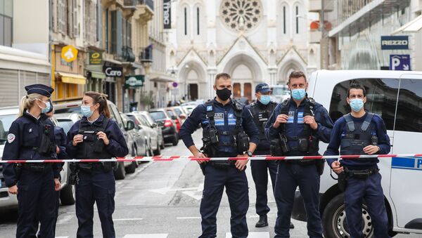 Police block the access to the Notre-Dame de l'Assomption Basilica in Nice on 29 October 2020, after a knife-wielding man kills three people at the church, slitting the throat of at least one of them, in what officials are treating as the latest jihadist attack to rock the country. (Photo by Valery HACHE / AFP) - Sputnik International