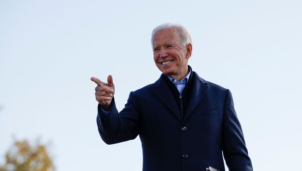 Democratic U.S. presidential nominee and former Vice President Joe Biden points a finger during a drive-in campaign stop, in Des Moines, Iowa, U.S., October 30, 2020.   REUTERS/Brian Snyder - Sputnik International