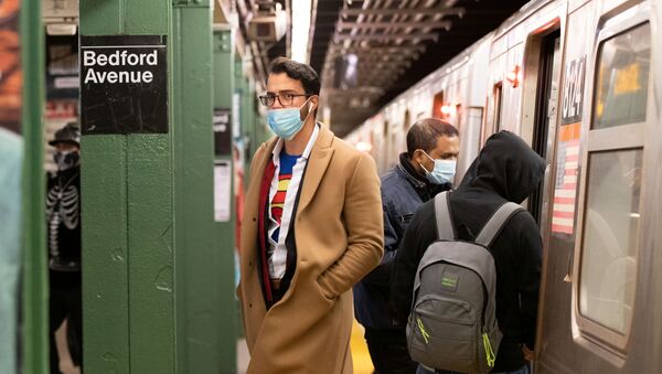 Commuters take the subway in costume on Halloween wearing masks as precautionary measure during the outbreak of the coronavirus disease (COVID-19) in Brooklyn, New York, U.S., October 31, 2020. Picture taken October 31, 2020.  - Sputnik International
