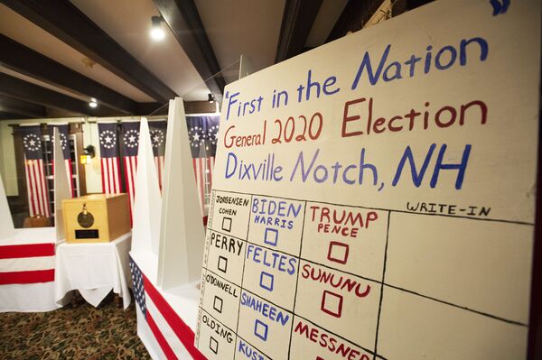 A board with the names of the candidates is seen in the room where voters will cast their ballots at Hale House, on the historic Balsams Resort during midnight voting as part of the first ballots cast in the United States Presidential Election in Dixville Notch, New Hampshire on 3 November 2020.  - Sputnik International