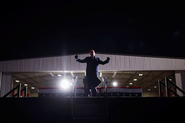 US President Donald Trump gestures at a campaign rally at Cherry Capital Airport in Traverse City, Michigan, US, 2 November 2020.  - Sputnik International