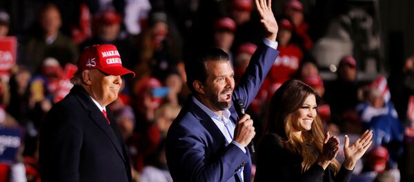 Kimberly Guilfoyle and Donald Trump Jr. wave and clap next to U.S. President Donald Trump during a campaign rally at Kenosha Regional Airport in Kenosha, Wisconsin, U.S., November 2, 2020. Kimberly Guilfoyle and Donald Trump Jr. wave and clap next to U.S. President Donald Trump during a campaign rally at Kenosha Regional Airport in Kenosha, Wisconsin, U.S., November 2, 2020. - Sputnik International
