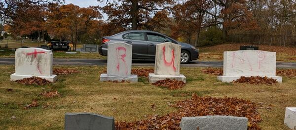 Graves are tagged with graffiti reading TRUMP at a Jewish cemetery in Grand Rapids. The graffiti was discovered on November 2, 2020 - Sputnik International