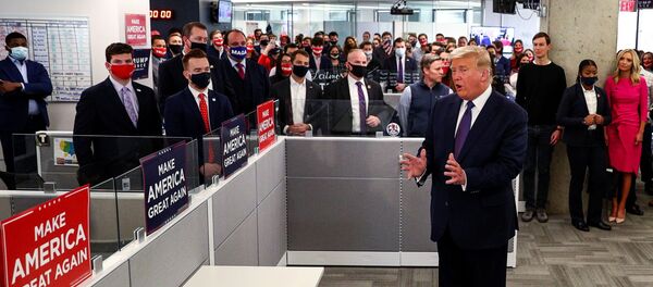 U.S. President Donald Trump greets staff members as he visits his presidential campaign headquarters on Election Day in nearby Arlington, Virginia, U.S., November 3, 2020. REUTERS/Tom Brenner - Sputnik International