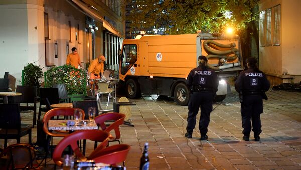 Hastily left drinks are seen on a table as cleaning crews and police work outside a restaurant near the scene of an attack in Vienna, Austria on November 3, 2020, one day after a shooting at multiple locations across central Vienna.  - Sputnik International