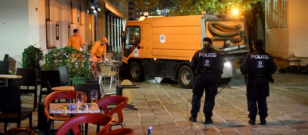 Hastily left drinks are seen on a table as cleaning crews and police work outside a restaurant near the scene of an attack in Vienna, Austria on November 3, 2020, one day after a shooting at multiple locations across central Vienna. Hastily left drinks are seen on a table as cleaning crews and police work outside a restaurant near the scene of an attack in Vienna, Austria on November 3, 2020, one day after a shooting at multiple locations across central Vienna. - Sputnik International