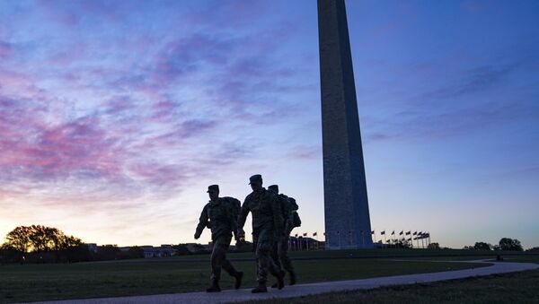 United States National Guard members walk towards the White House from the Washington Monument on Election Day, Tuesday, Nov. 3, 2020, in Washington. - Sputnik International
