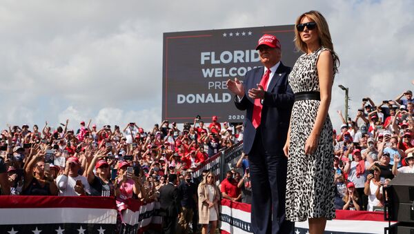U.S. President Donald Trump applauds next to first lady Melania Trump his campaign rally outside Raymond James Stadium, in Tampa, Florida, U.S., October 29, 2020 - Sputnik International