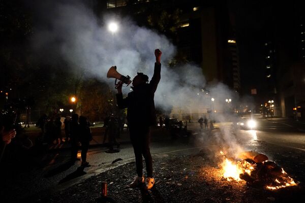 A protester yells after a march to the Mark O Hatfield United States Courthouse on the night of the election, in Portland, Oregon, Tuesday 3 November 2020. - Sputnik International