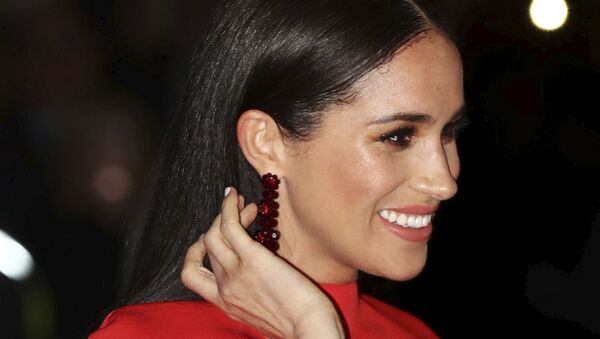 Britain's Meghan, Duchess of Sussex arrives with Prince Harry at the Royal Albert Hall in London, 7 March 2020, to attend the Mountbatten Festival of Music - Sputnik International
